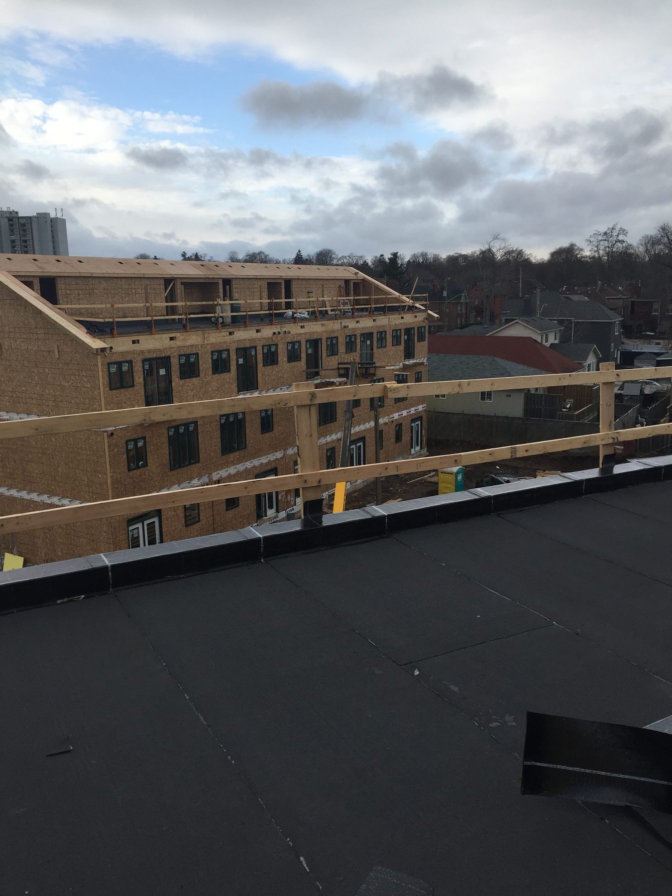 Roofing work at a condominium construction project on Barton Street